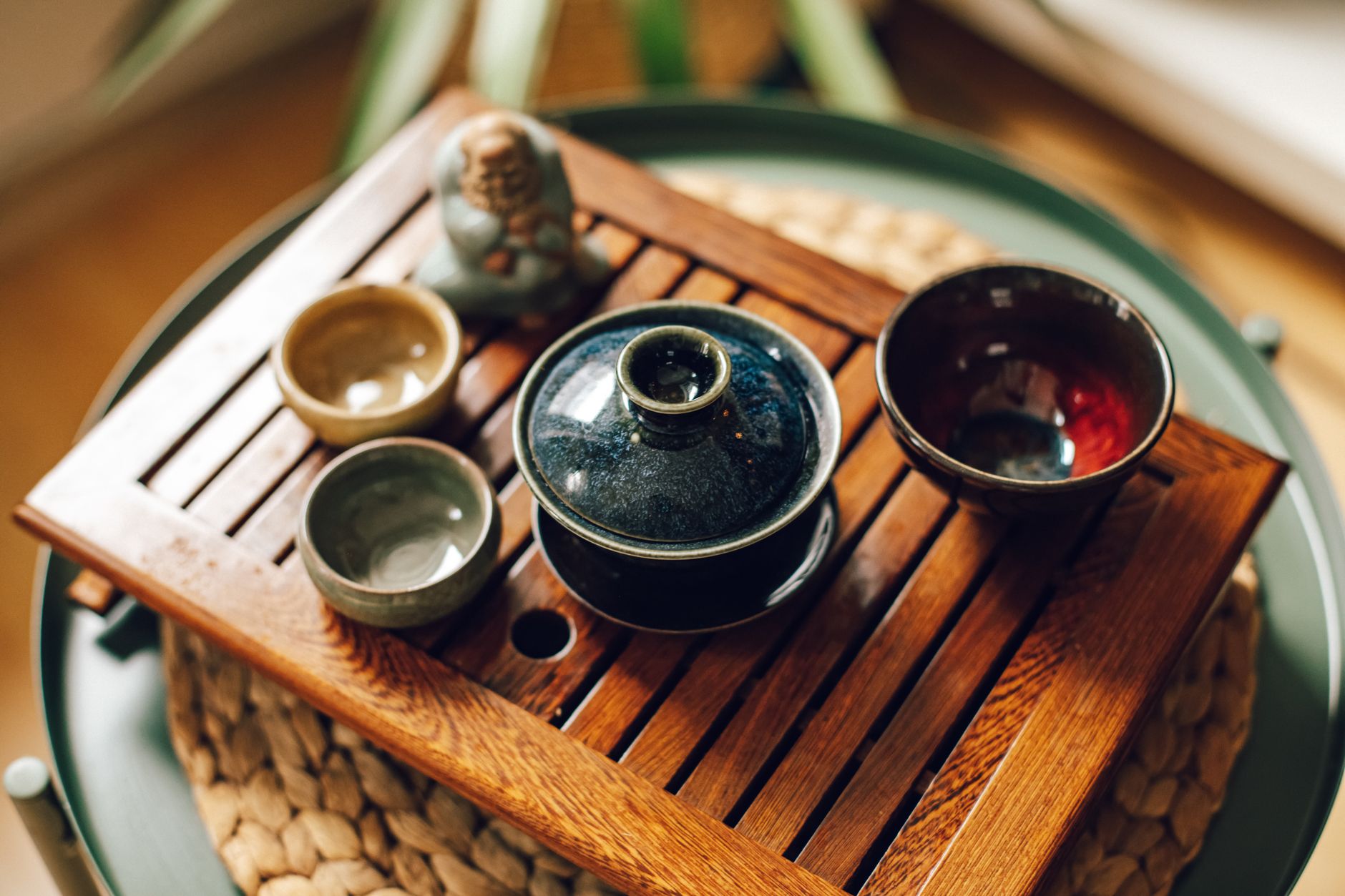 Ceramic tea vessel on cedar table in Kyoto temple