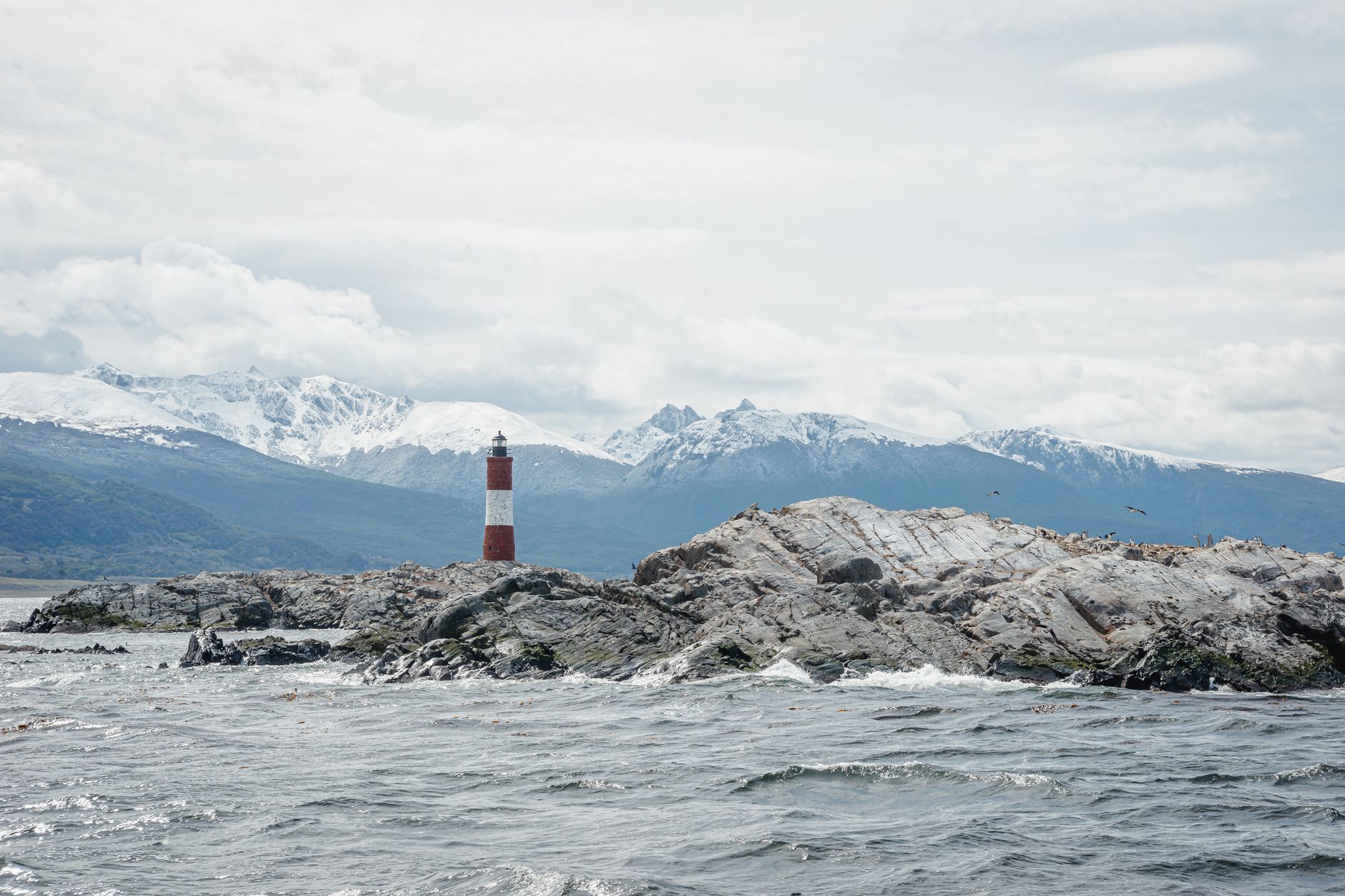 Wild coastal landscape with blue waves and cliffs